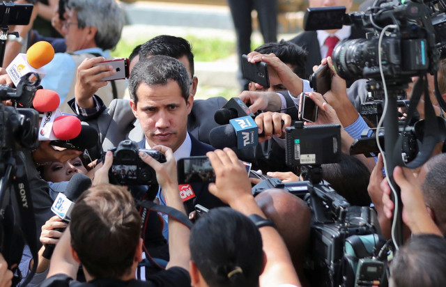 Venezuelan opposition leader Juan Guaido, who many nations have recognised as the country's rightful interim ruler, talks to the media as he arrives to Venezuela's National Assembly in Caracas, Venezuela September 17, 2019. REUTERS/Ivan Alvarado