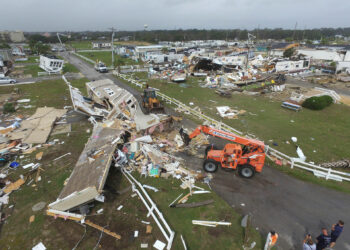 CORRECTS YEAR TO 2019-Emerald Isle town employees work to clear the road after a tornado hit Emerald Isle N.C. as Hurricane Dorian moved up the East coast on Thursday, Sept. 5, 2019. (AP Photo/Tom Copeland)