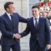 French President Emmanuel Macron (L) welcomes Ukrainian President Volodymyr Zelensky (R) before their meeting at the Elysee presidential palace in Paris on June 17, 2019 in Paris. (Photo by ludovic MARIN / AFP)