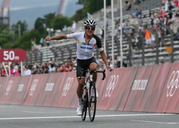 Ecuador's Richard Carapaz celebrates after crossing the finish line to win the men's cycling road race during the Tokyo 2020 Olympic Games at the Fuji International Speedway in Oyama, Japan, on July 24, 2021. (Photo by Greg Baker / AFP) (Photo by GREG BAKER/AFP via Getty Images)