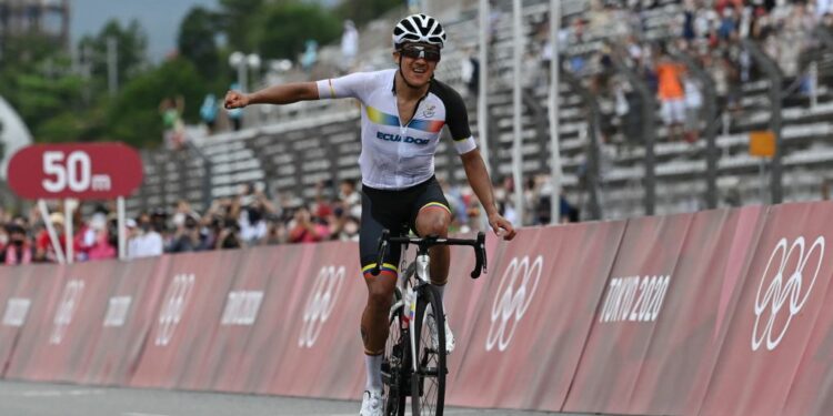 Ecuador's Richard Carapaz celebrates after crossing the finish line to win the men's cycling road race during the Tokyo 2020 Olympic Games at the Fuji International Speedway in Oyama, Japan, on July 24, 2021. (Photo by Greg Baker / AFP) (Photo by GREG BAKER/AFP via Getty Images)