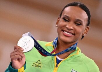 Brazil's Rebeca Andrade poses with her silver medal during the podium ceremony of the artistic gymnastics women's all-around final during the Tokyo 2020 Olympic Games at the Ariake Gymnastics Centre in Tokyo on July 29, 2021. (Photo by MARTIN BUREAU / AFP) (Photo by MARTIN BUREAU/AFP via Getty Images)