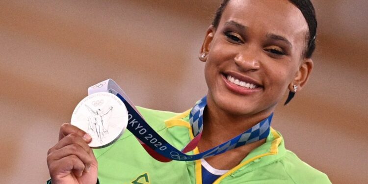 Brazil's Rebeca Andrade poses with her silver medal during the podium ceremony of the artistic gymnastics women's all-around final during the Tokyo 2020 Olympic Games at the Ariake Gymnastics Centre in Tokyo on July 29, 2021. (Photo by MARTIN BUREAU / AFP) (Photo by MARTIN BUREAU/AFP via Getty Images)