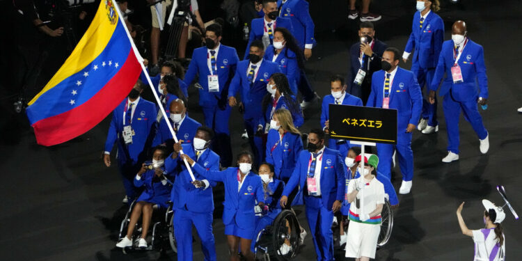 Athletes from Venezuela enter the stadium during the opening ceremony for the 2020 Paralympics at the National Stadium in Tokyo, Tuesday, Aug. 24, 2021. (AP Photo/Eugene Hoshiko)