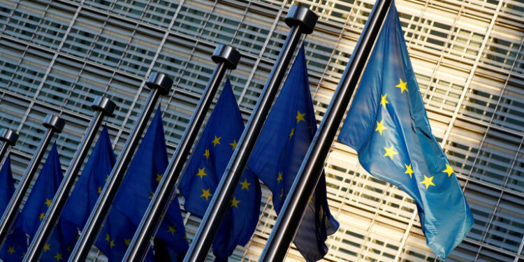 FILE PHOTO: European Union flags are seen outside the EU Commission headquarters in Brussels, Belgium November 14, 2018.  REUTERS/Francois Lenoir/File Photo