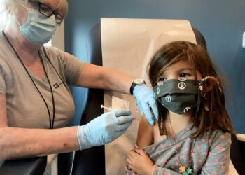 Bridgette Melo, 5, prepares for her inoculation of one of two reduced 10 ug doses of the Pfizer BioNtech COVID-19 vaccine during a trial at Duke University in Durham, North Carolina September 28, 2021 in a still image from video. Video taken September 28, 2021. Shawn Rocco/Duke University/Handout via REUTERS NO RESALES. NO ARCHIVES. THIS IMAGE HAS BEEN SUPPLIED BY A THIRD PARTY.