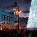 People walk under Christmas lights at Puerta del Sol square, amid the coronavirus disease (COVID-19) pandemic, in Madrid, Spain, December 8, 2021. REUTERS/Susana Vera