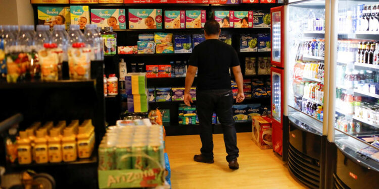 A man looks at diapers in a convenience store at a five-star hotel in Caracas, Venezuela October 12, 2018. Picture taken October 12, 2018. REUTERS/Marco Bello