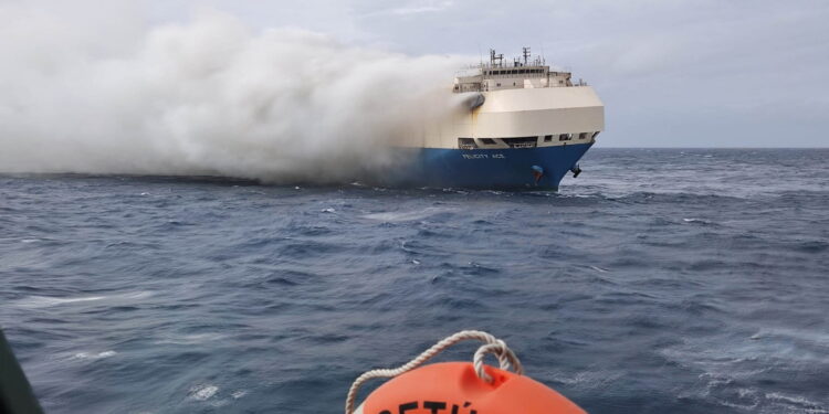 The ship, Felicity Ace, which was traveling from Emden, Germany, where Volkswagen has a factory, to Davisville, in the U.S. state of Rhode Island, burns more than 100 km from the Azores islands, Portugal, February 18, 2022. Portuguese Navy (Marinha Portuguesa)/Handout via REUTERS THIS IMAGE HAS BEEN SUPPLIED BY A THIRD PARTY.