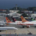 Commercial planes of different airlines and private jets sit on the tarmac at Simon Bolivar International Airport, in Maiquetia, Vargas State, Venezuela, on December 15, 2020. - Air workers in Venezuela are facing an unemployment crisis due to the novel coronavirus, COVID-19, pandemic. The country's private airlines were grounded for months due to the pandemic but when flights were allowed to resume, the government closed most of the routes covered, leaving only Turkey, Bolivia and Mexico open. (Photo by Yuri CORTEZ / AFP)