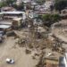 Aerial view of the zone affected by a landslide during heavy rains in Las Tejerias, Aragua state, Venezuela, on October 10, 2022. - A landslide in central Venezuela left at least 22 people dead and more than 50 missing after heavy rains caused a river to overflow, Vice President Delcy Rodriguez said Sunday. (Photo by Yuri CORTEZ / AFP)