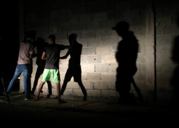 Members of the Special Action Force of the Venezuelan National Police (FAES) stop people during a night patrol, in Barquisimeto, Venezuela September 20, 2019. Picture taken September 20, 2019 REUTERS/Ivan Alvarado