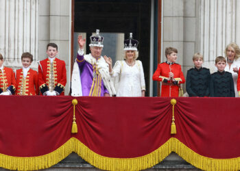 Britain's King Charles and Queen Camilla wave on the Buckingham Palace balcony following their coronation ceremony in London, Britain May 6, 2023. REUTERS/Matthew Childs