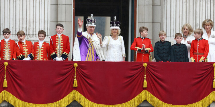 Britain's King Charles and Queen Camilla wave on the Buckingham Palace balcony following their coronation ceremony in London, Britain May 6, 2023. REUTERS/Matthew Childs