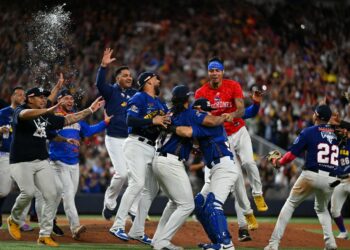 Venezuelan players celebrate their victory in the Caribbean Baseball Championship after the final game against the Dominican Republic at LoanDepot Park in Miami, Florida, February 9, 2024. (Photo by Chandan Khanna / AFP)
