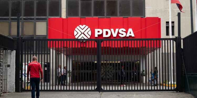 View of the entrance of the headquarters of Petróleos de Venezuela (PDVSA) in Caracas, taken on September 13, 2023. (Photo by Miguel Zambrano / AFP)